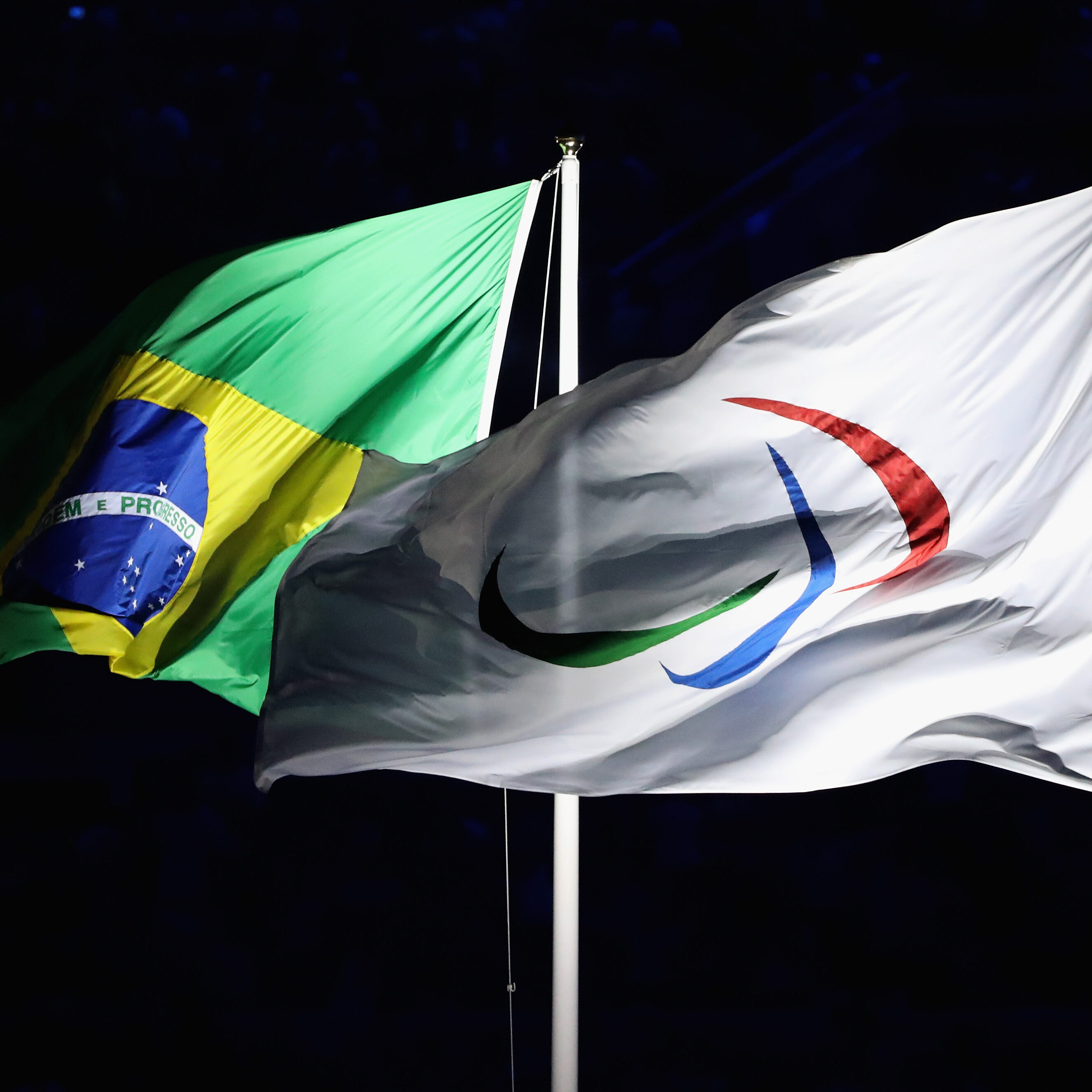 RIO DE JANEIRO, BRAZIL - SEPTEMBER 07:  (R-L)The flags of the International Paralympic Committee and of Brazil fly during the Opening Ceremony of the Rio 2016 Paralympic Games at Maracana Stadium on September 7, 2016 in Rio de Janeiro, Brazil.  (Photo by Friedemann Vogel/Getty Images)